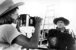 Rita Hayworth photographing Burt Lancaster on the set of The Unforgiving, 1960